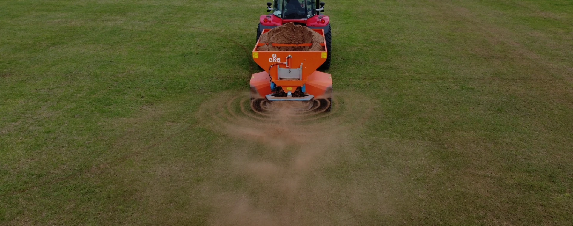 Tractor upkeeping grass aerial shot